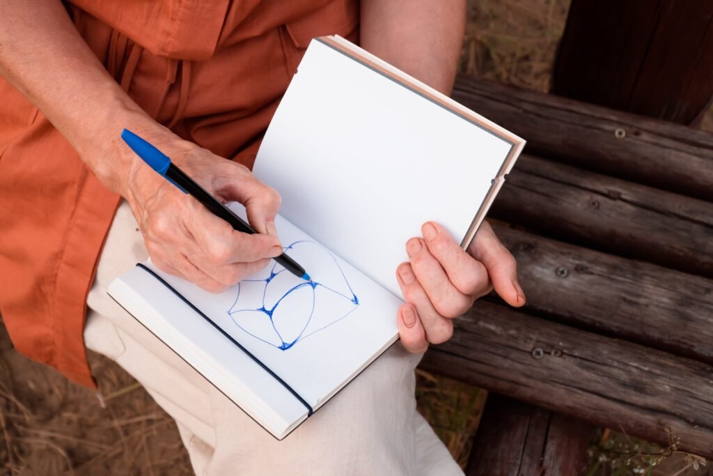 People drawing together outdoors